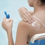 Woman Applying Sunscreen